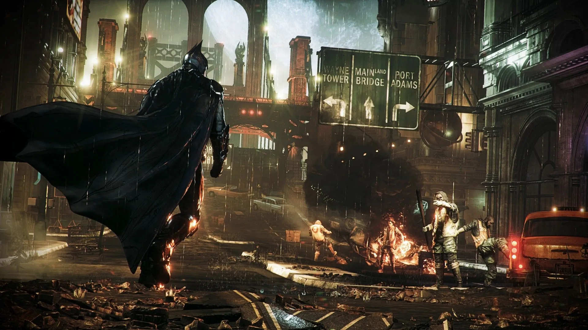 Batman đang tiến đến những tên tội phạm đang phá hủy thiết bị trong Batman Arkham Knight.