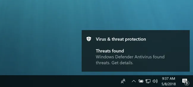 Biểu tượng virus máy tính màu đỏ tượng trưng cho sự lây nhiễm phần mềm độc hại