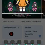 Giao diện trò chơi Đèn Xanh Đỏ Squid Game ẩn trên ứng dụng Google, hiển thị búp bê Young-hee và các người chơi.
