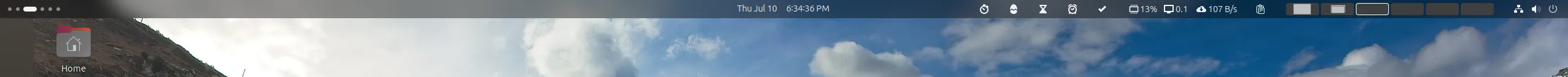 Thanh Top Bar của Ubuntu hiển thị các tiện ích mở rộng (extensions) như giám sát hệ thống và thời gian.