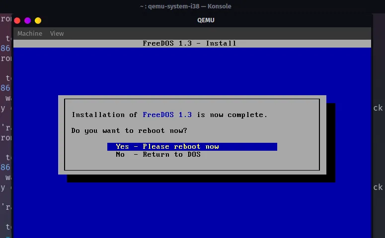 Thông báo hoàn tất quá trình cài đặt FreeDOS trên QEMU, sẵn sàng sử dụng hệ thống DOS.