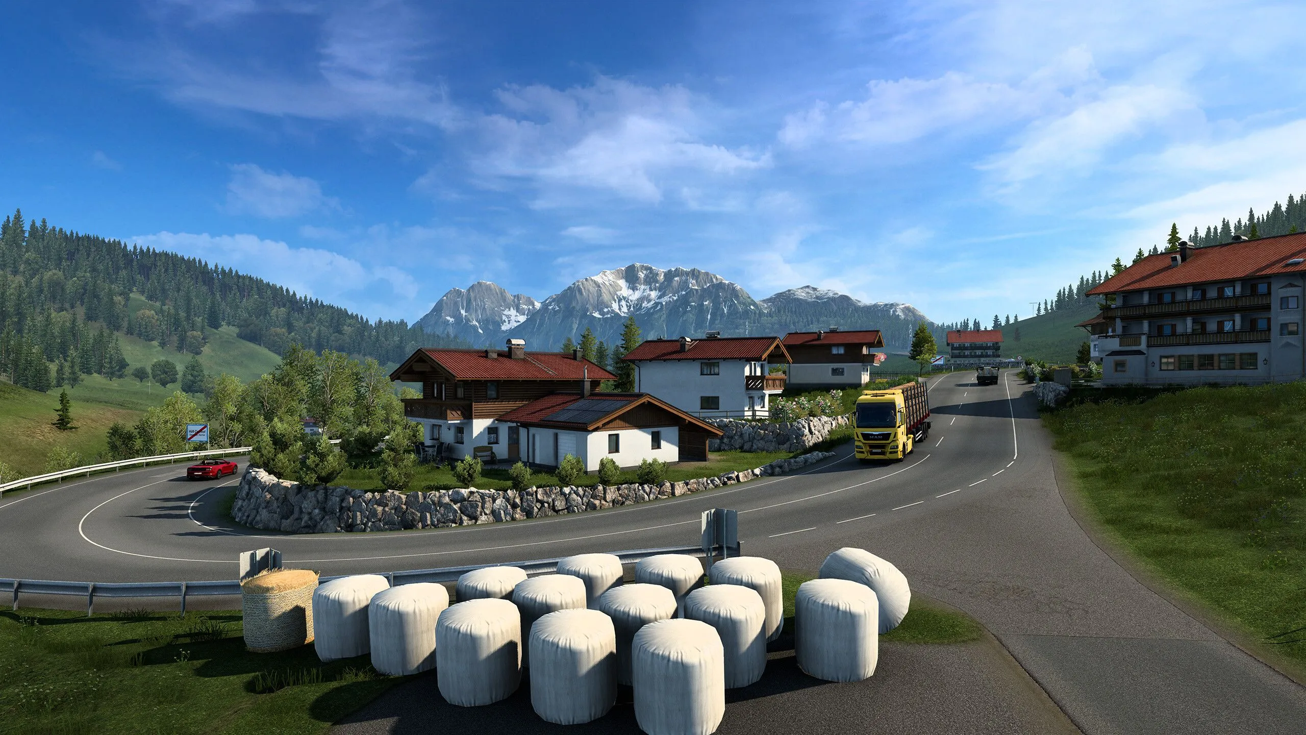 Xe tải đang di chuyển trên đường cao tốc ở châu Âu trong Euro Truck Simulator 2, với cảnh quan môi trường và đường sá được mô phỏng chi tiết, thể hiện trải nghiệm lái xe chân thực.